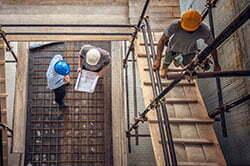 Workers in hard hats at construction site